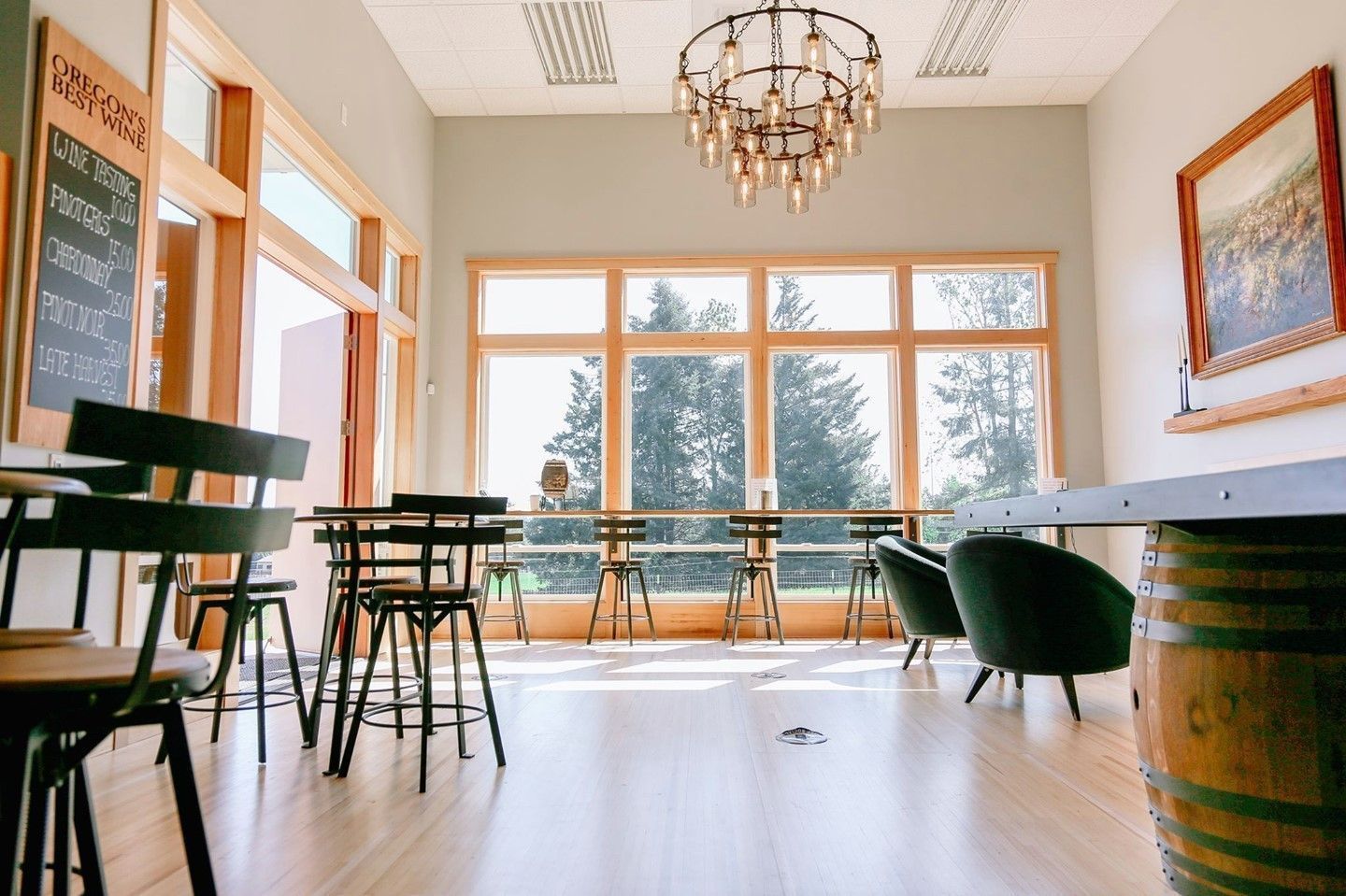 Tasting Room Interior, Chair seating and bar height seating, large windows looking over vineyards
